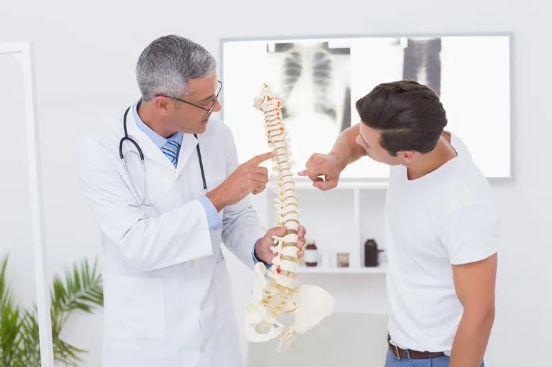 Medical consultation with spine model